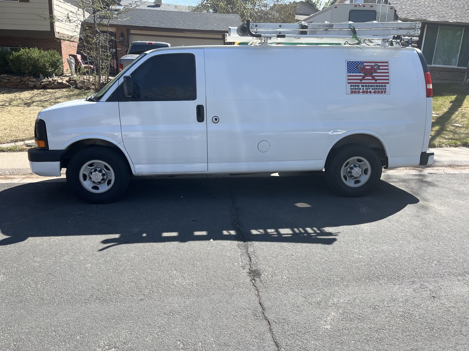 Pipe Wrenchers Sewer & Jet Services work van with logo and phone number